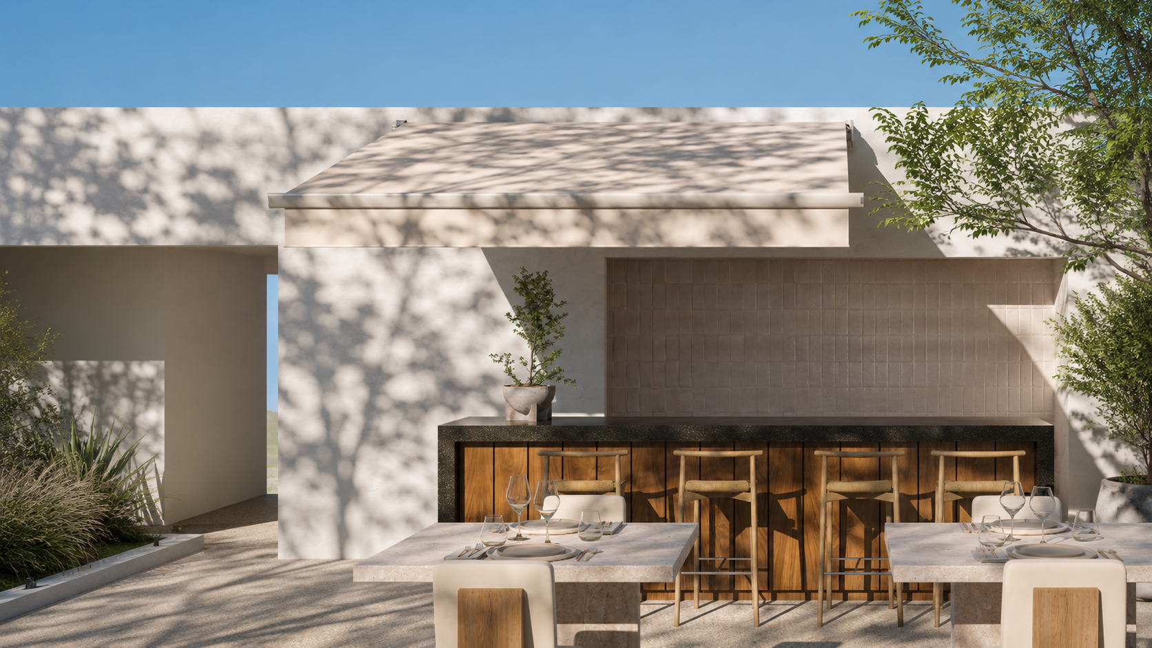 Cassette awning shading an outdoor dining terrace